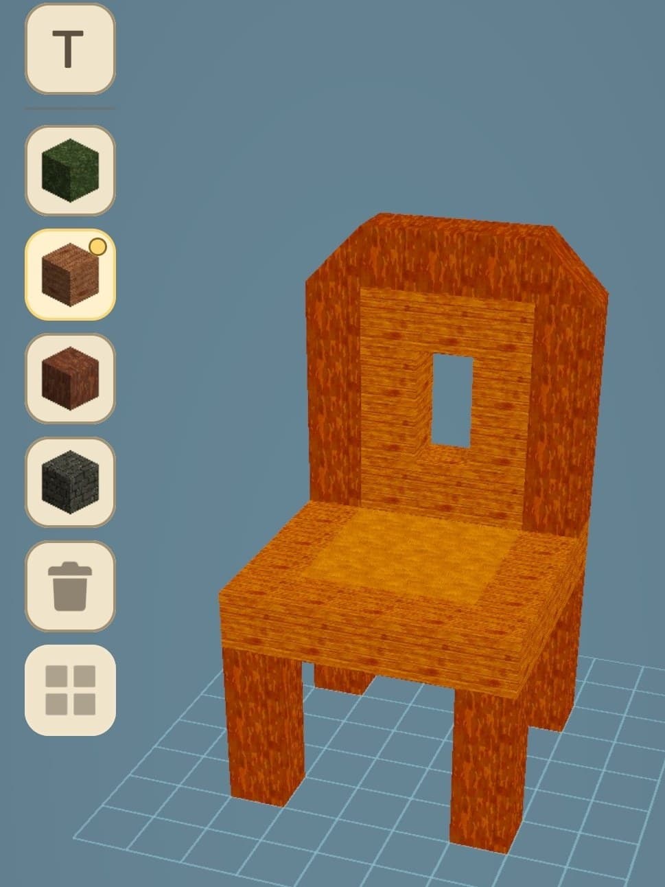 The in-game editor showing a wooden chair being built block by block from a palette of materials
